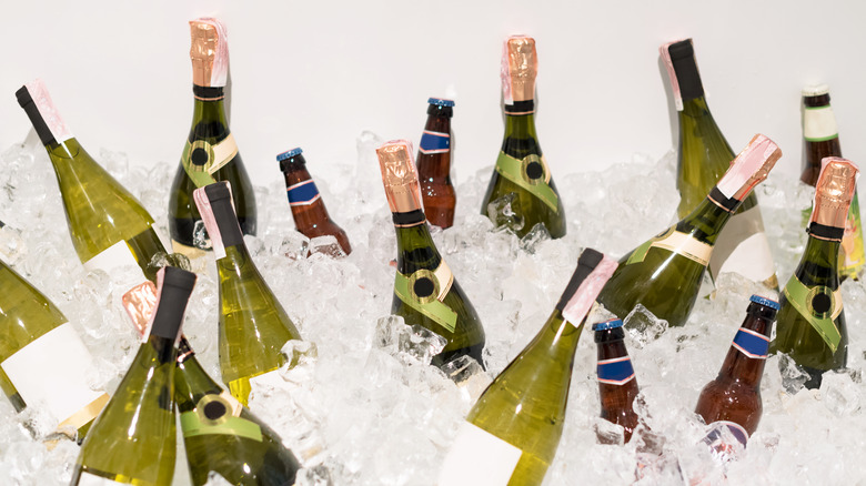 bottles of wine and beer in an ice bath