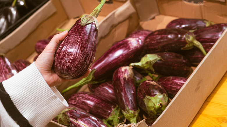 pile of eggplants at the grocery store