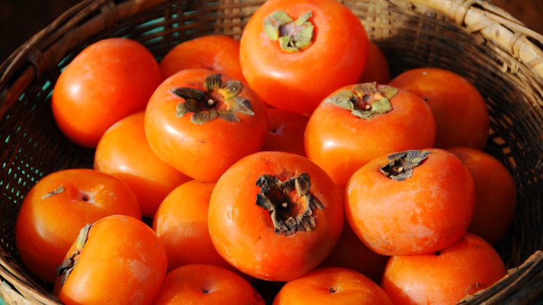 persimmons in a basket