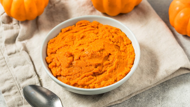 Bowl of pumpkin puree on cloth