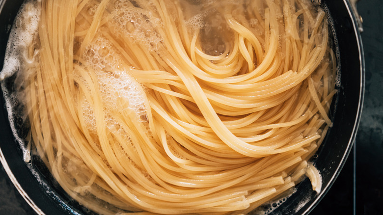 pasta cooking in pot of water