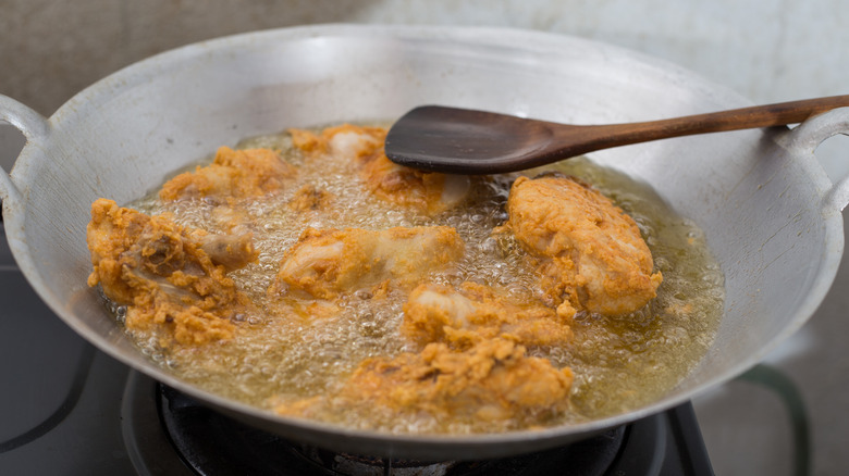 fried chicken in frying pan