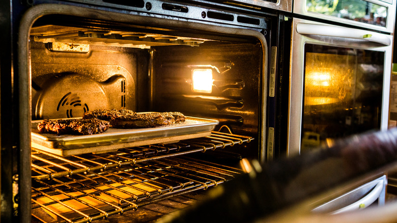 steaks reheating in oven