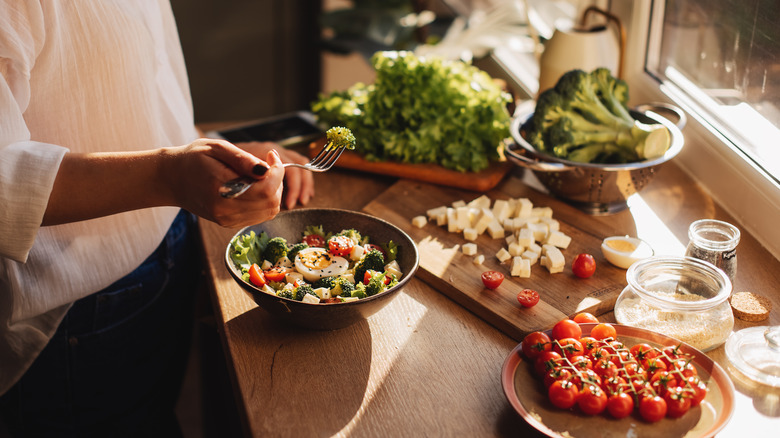 Woman making salad