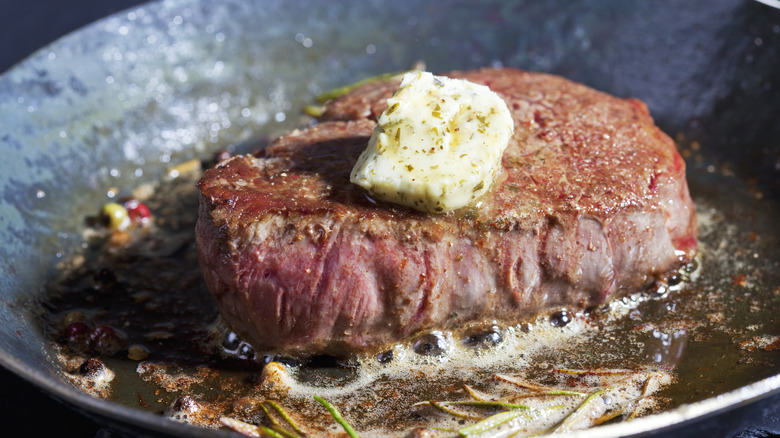 steak cooking with butter