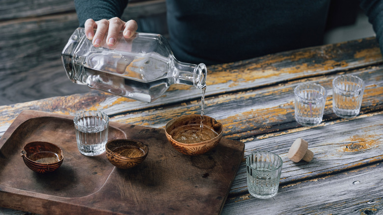 pouring sotol into a bowl