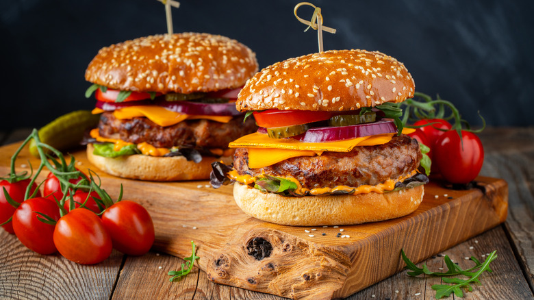 Cheeseburgers on wooden board