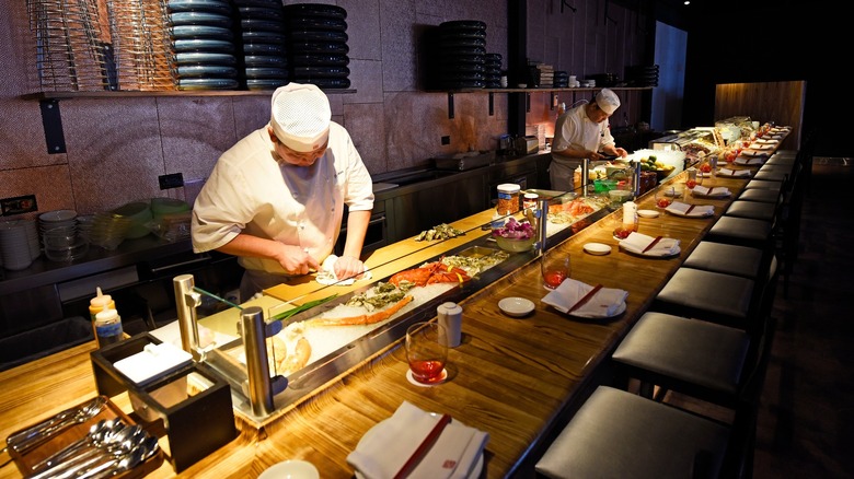 chef prepping omakase