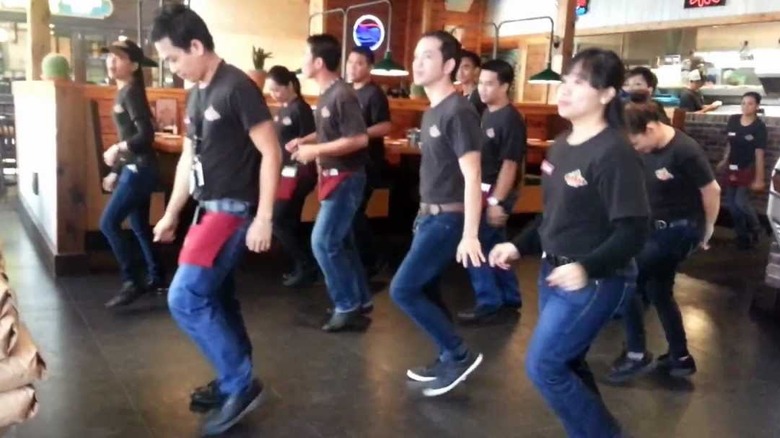 Texas Roadhouse employees line dancing