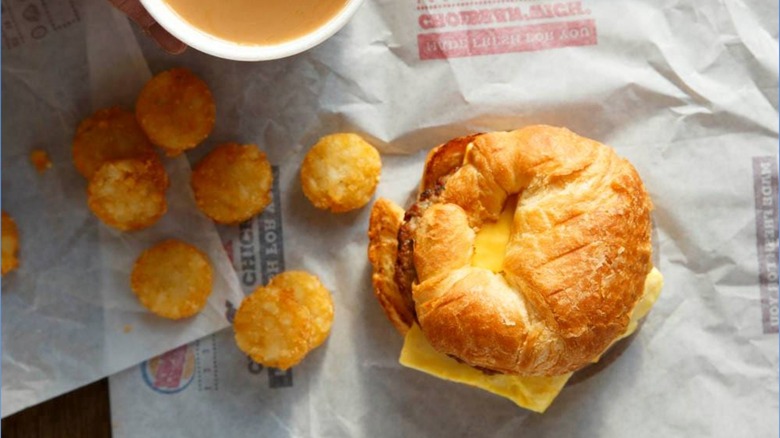 burger king breakfast sandwich, hash browns, and coffee