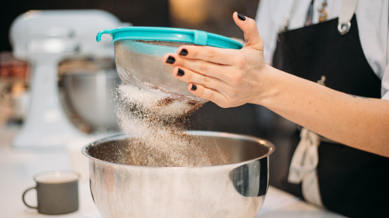 Sifting flour with sieve