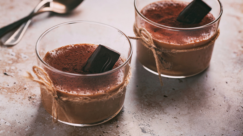 two chocolate mousse desserts in glass cups