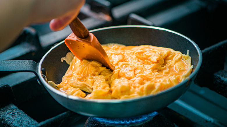 Scrambled eggs cooking in a pan