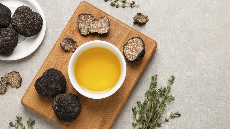 Sliced black truffles with olive oil and thyme