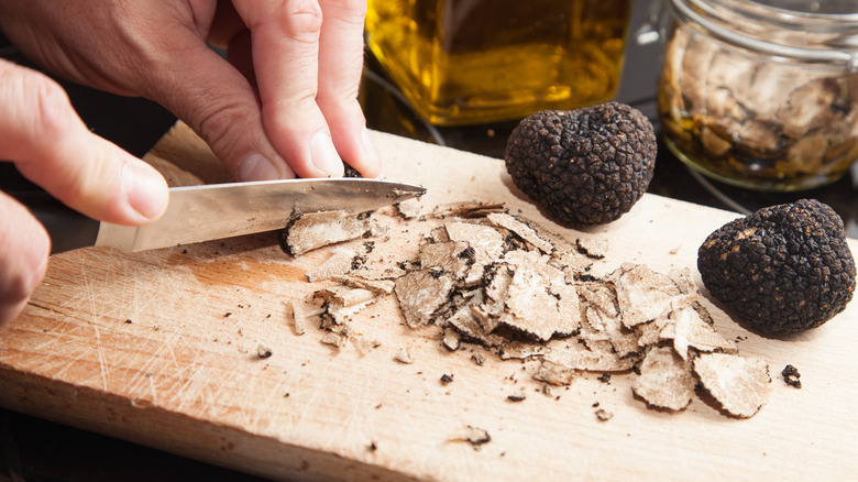 Slicing fresh truffles on a cutting board