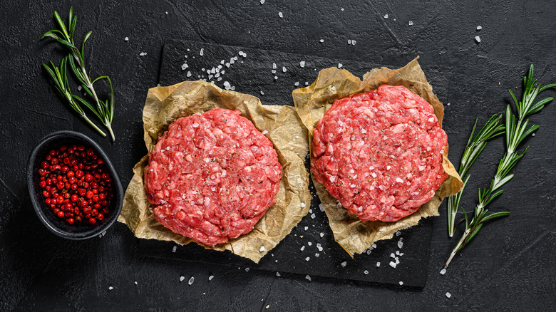 raw hamburger meat surrounded by salt