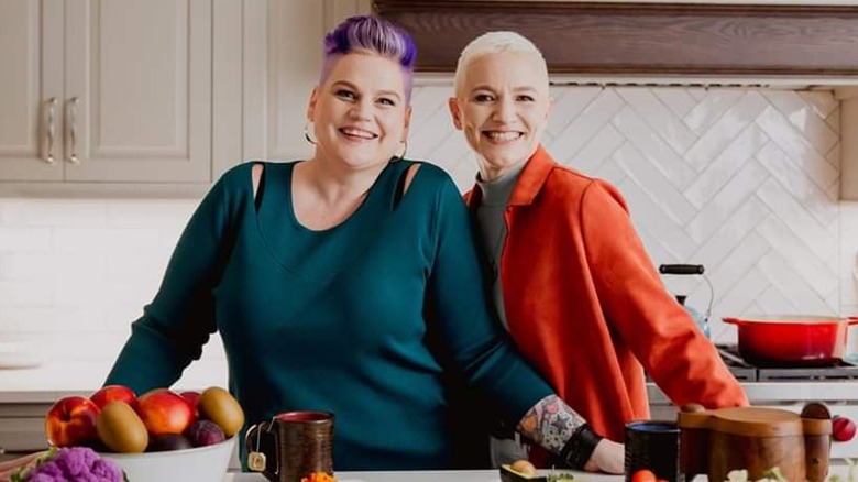 Nona Johnson and Briana Murray standing in a kitchen smiling