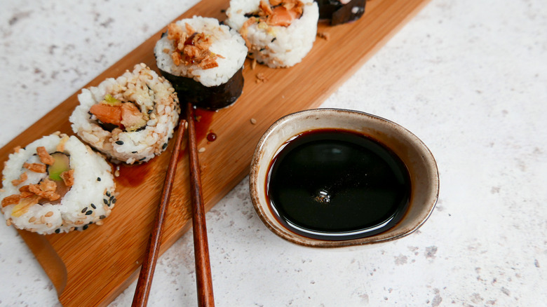 Eel sauce in bowl and sushi