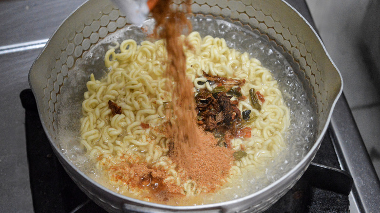 cooking instant ramen in boiling water