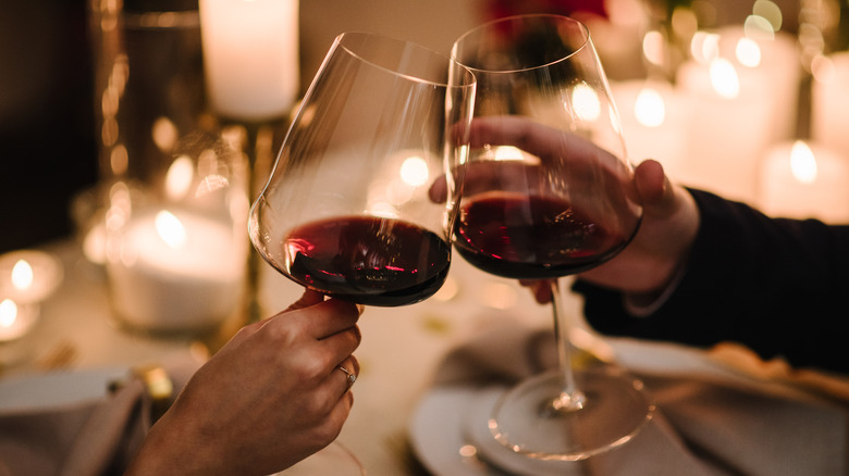 toasting glasses of wine at restaurant