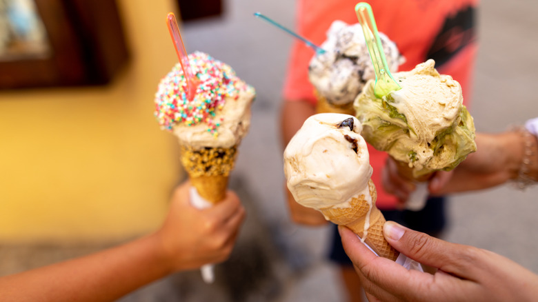 Group of foodies holding cones of gelato