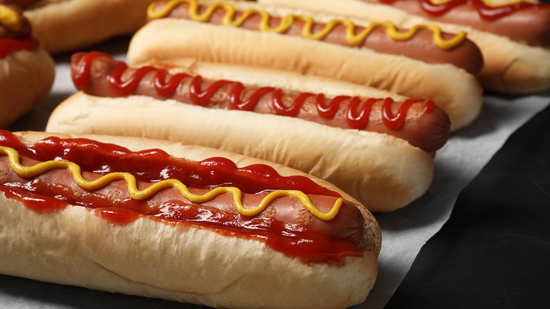 Hot dogs with ketchup and mustard on them