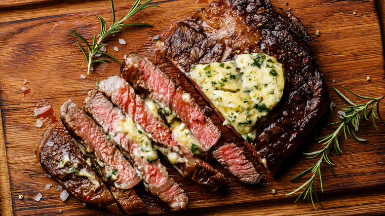 sliced steak with butter