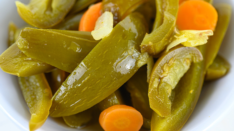 pickled jalapeño slices and sliced carrots in bowl