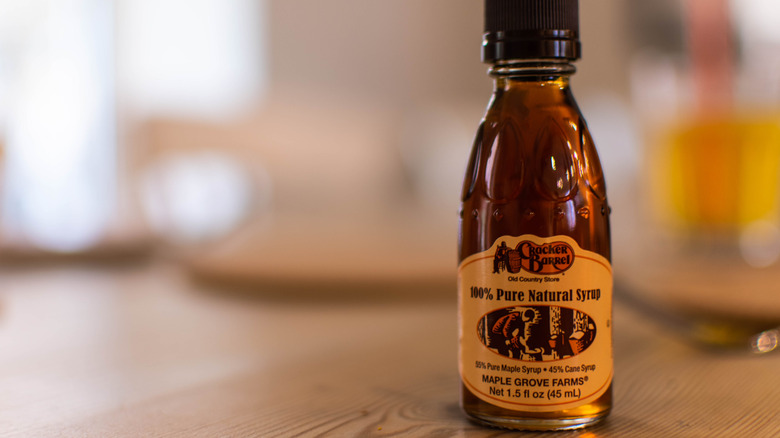 A miniature bottle of Cracker Barrel's syrup