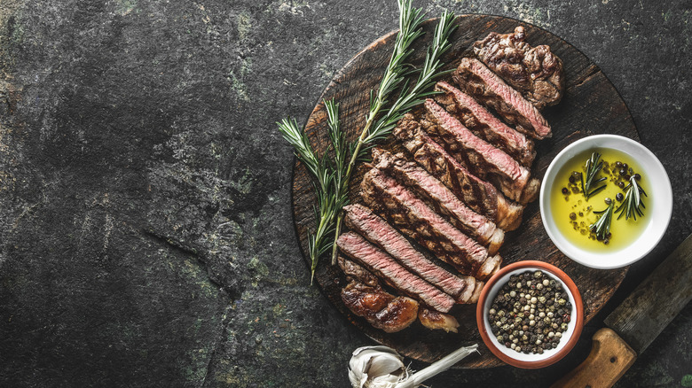 Sliced steak with oil and spices