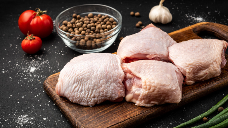 Raw chicken on cutting board