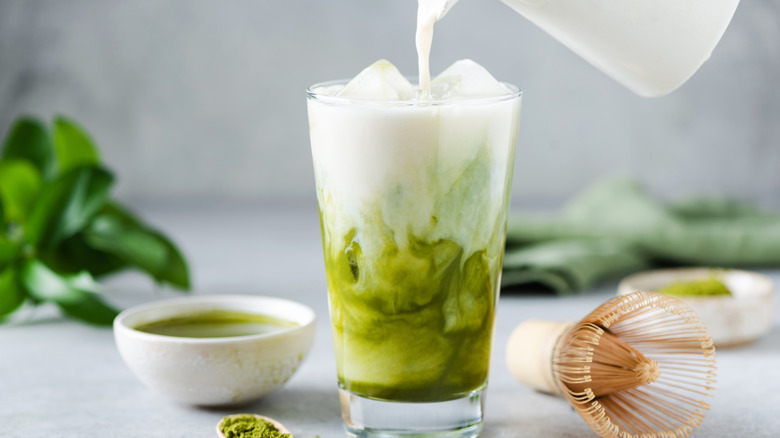 Pouring milk into matcha