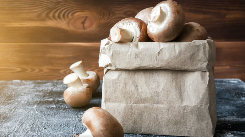 mushrooms in brown paper bag