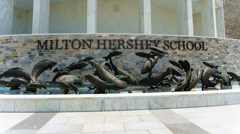 Milton Hershey School building signage with fish sculpture