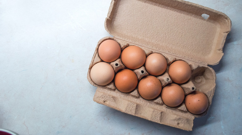 carton of brown eggs