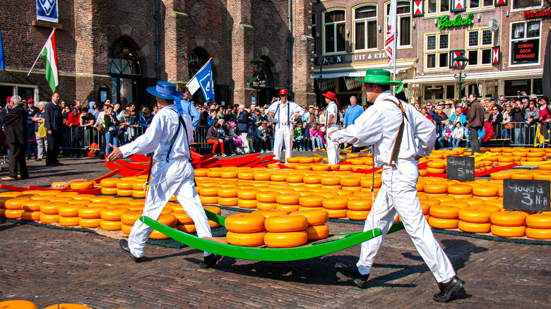 Cheese mongers moving cheese 