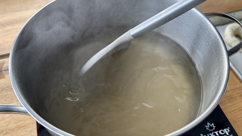 Stirring flavorings into simmering water