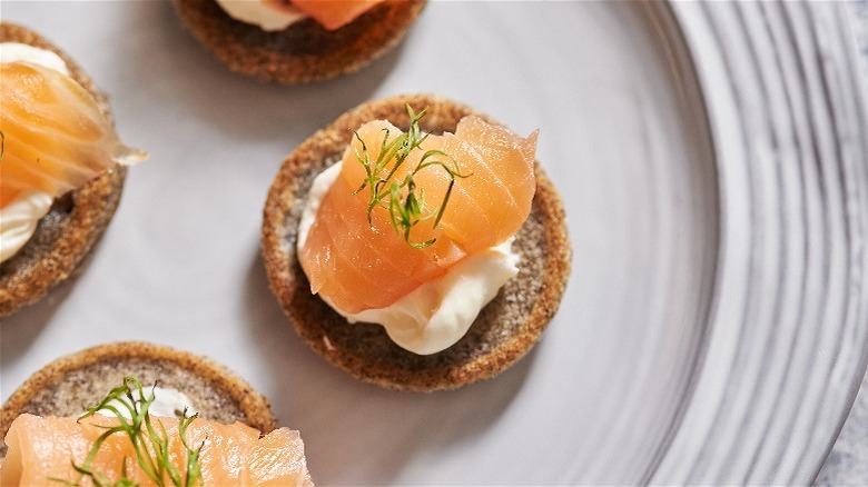 blini with salmon on plate