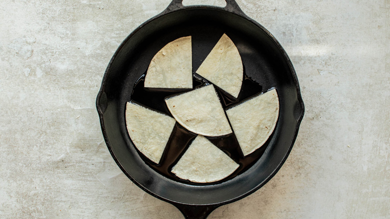 tortilla slices in skillet 