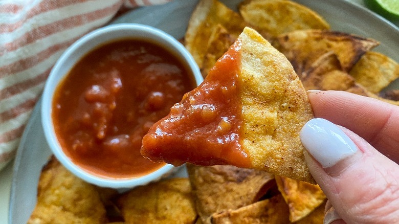 chip dipped in salsa