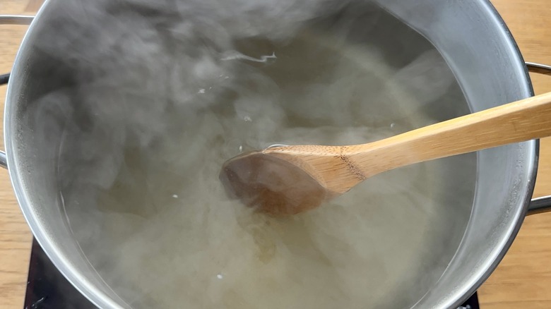 stirring ingredients in hot water