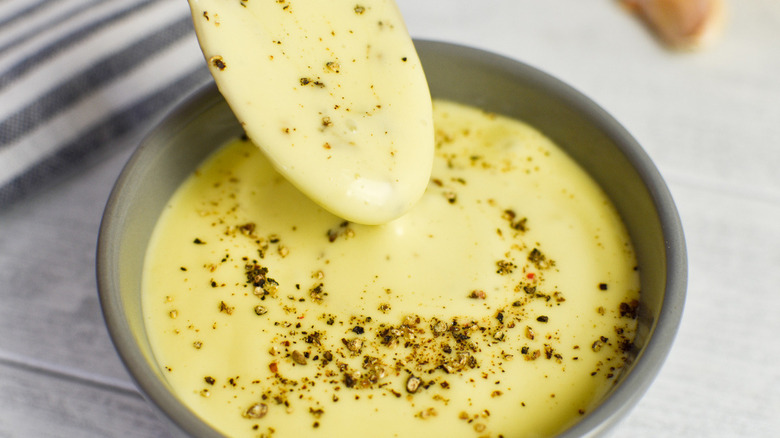 bowl of aioli with black pepper