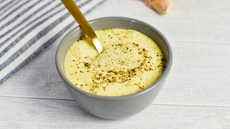 bowl of aioli with pepper garnish