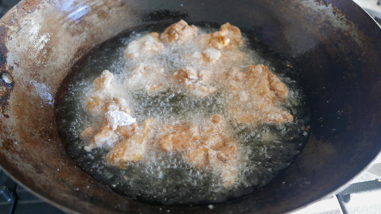 chicken frying in wok