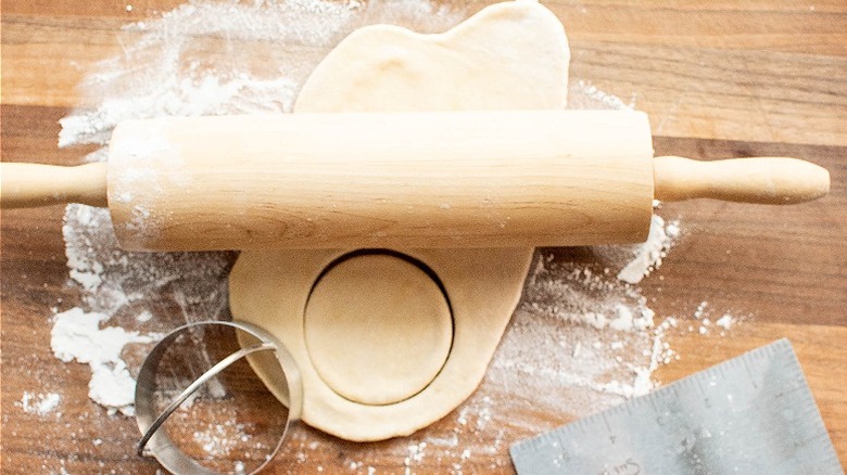 rolling out dough on surface