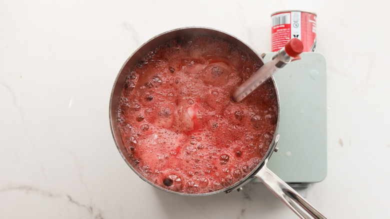 Pot of raspberry sugar simmering