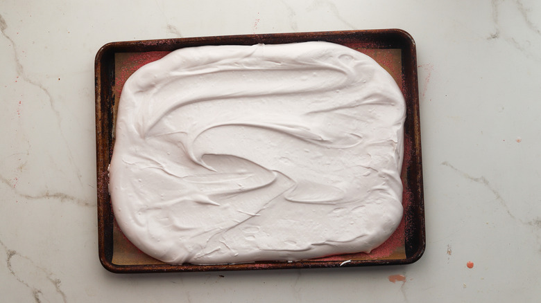 Spread marshmallow on sheet tray