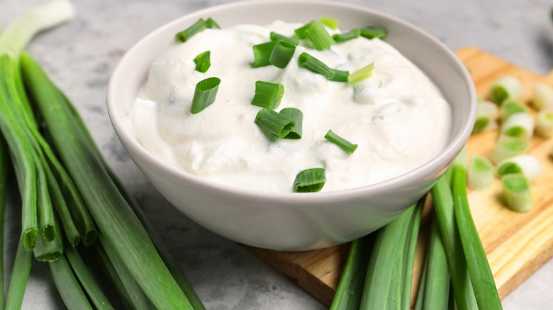 sour cream in a bowl with scallions