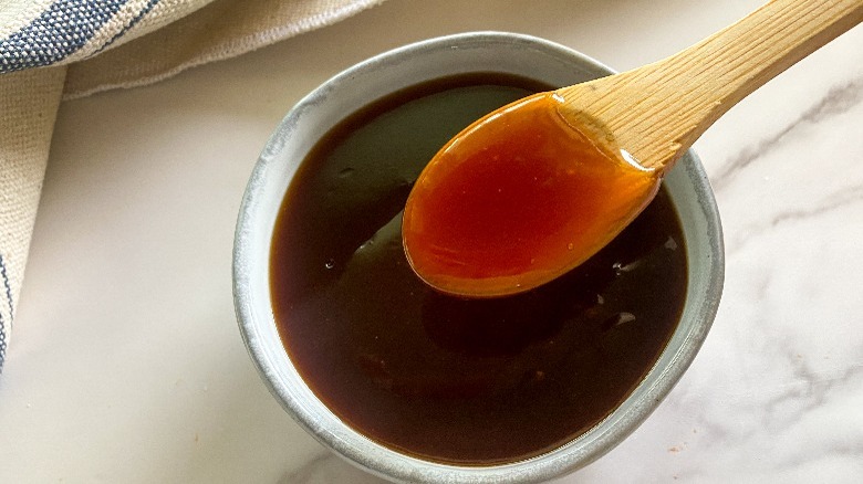 sauce and wooden spoon