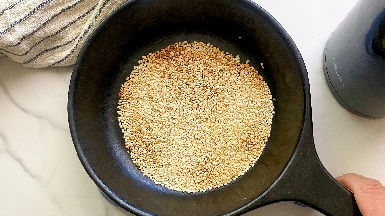 sesame seeds in black pan